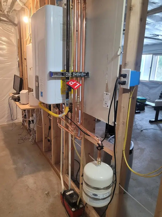 Licensed plumber repairing a kitchen sink in Winchester
